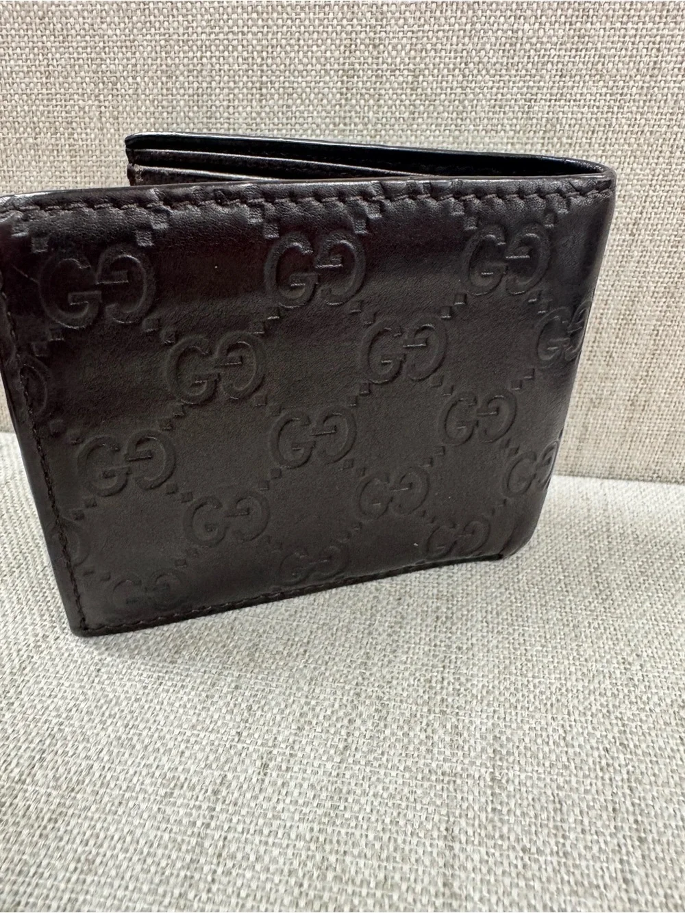 Gucci Dark Brown Embossed GG Leather Bifold Wallet